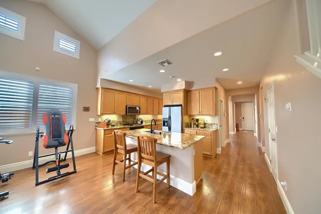 a room with garden equipment and wooden floor