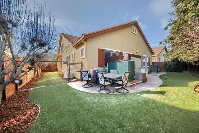 a view of a hallway with a room and wooden floor