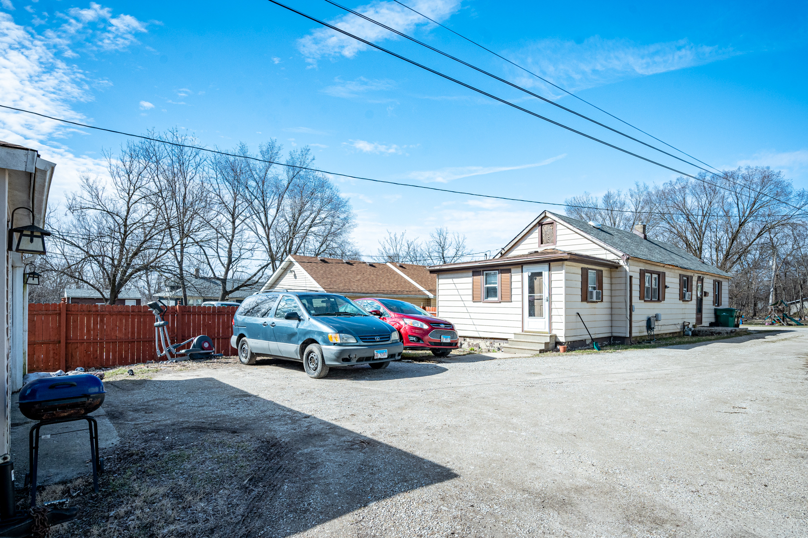 124 Barry Avenue Lockport, IL 60441 - Photo 8 of 9 a car parked in front of white house