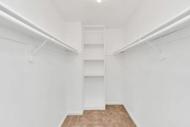 a view of hallway with closet