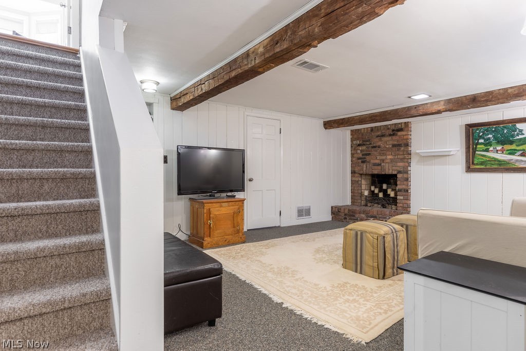 22732 Rye Road Beachwood, OH 44122 - Photo 25 of 27 In the basement, two family rooms (one with fireplace), a laundry room, and utility room. The finished section has newer Nature Stone Flooring and built-in bookshelves.