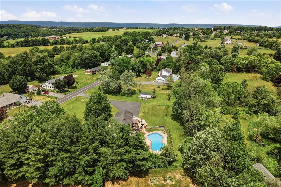 732 Bushkill Center Road Nazareth, PA 18064 - Photo 42 of 43 Discover a private pool oasis nestled in a sprawling, verdant landscape with picturesque countryside views.
