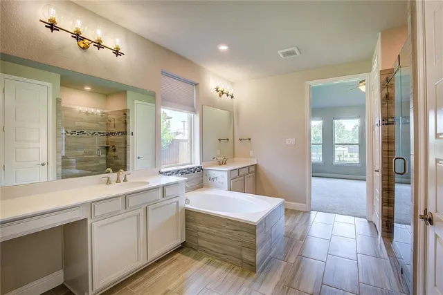 a bathroom with a glass shower door
