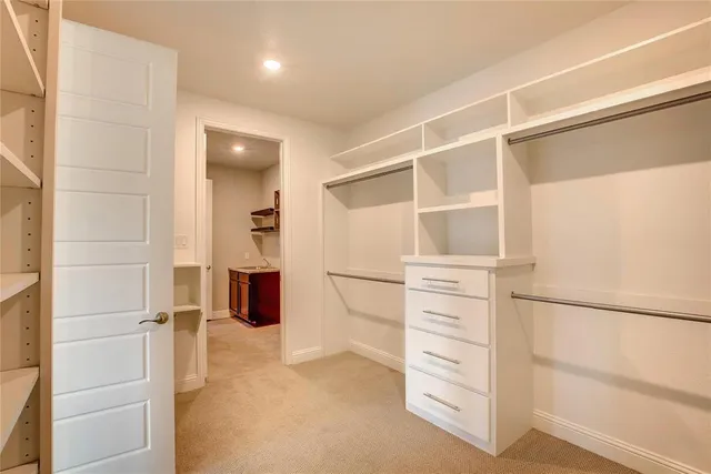 a bathroom with a sink a large mirror and a bathtub