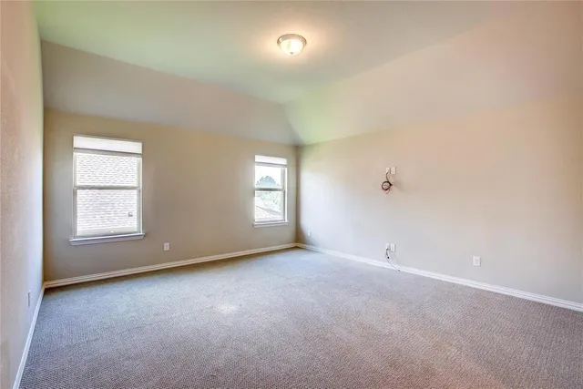 a view of a living room with furniture and a window