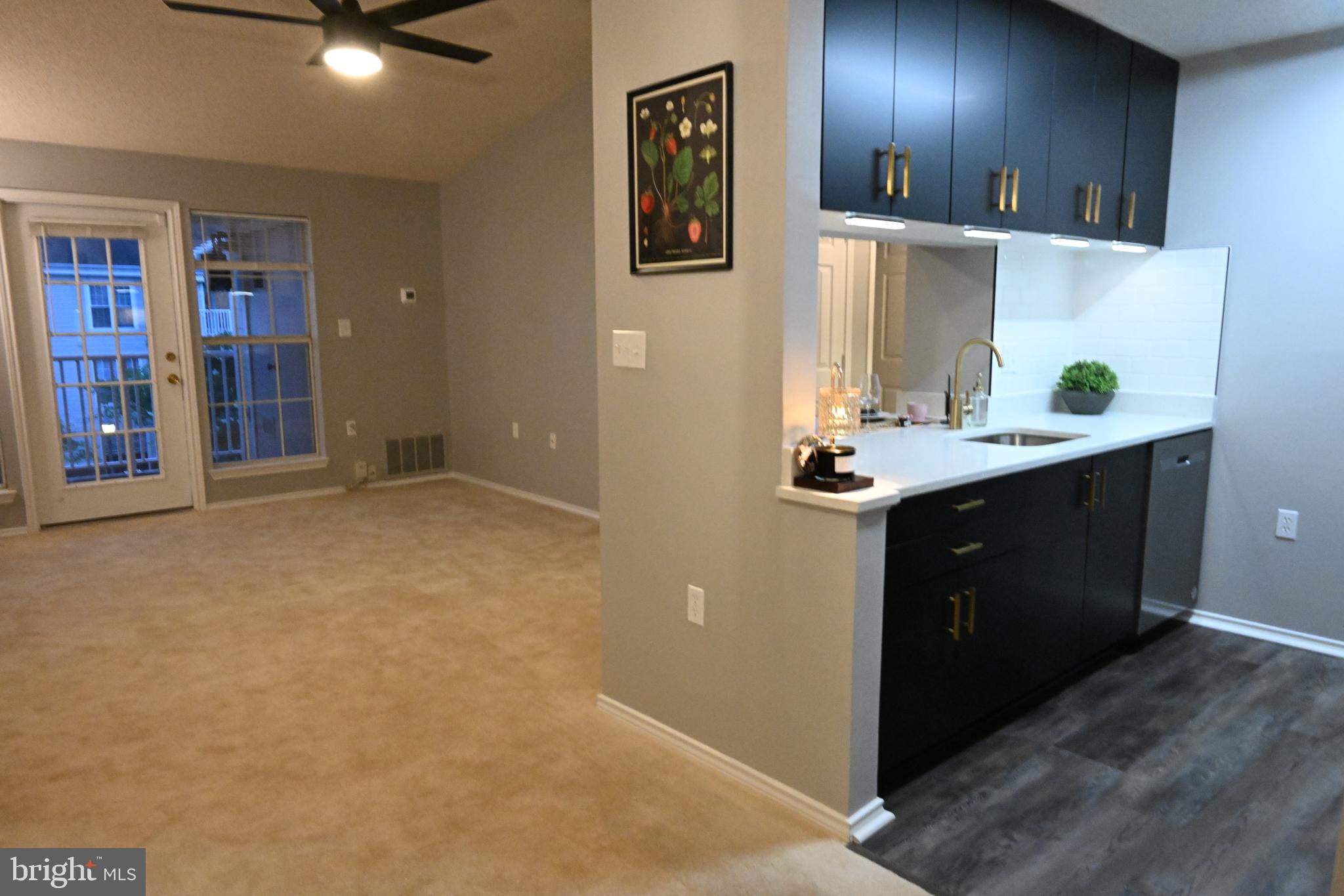 20965 Timber Ridge Terrace, Unit 304 Ashburn, VA 20147 - Photo 13 of 61 a kitchen with a sink and cabinets