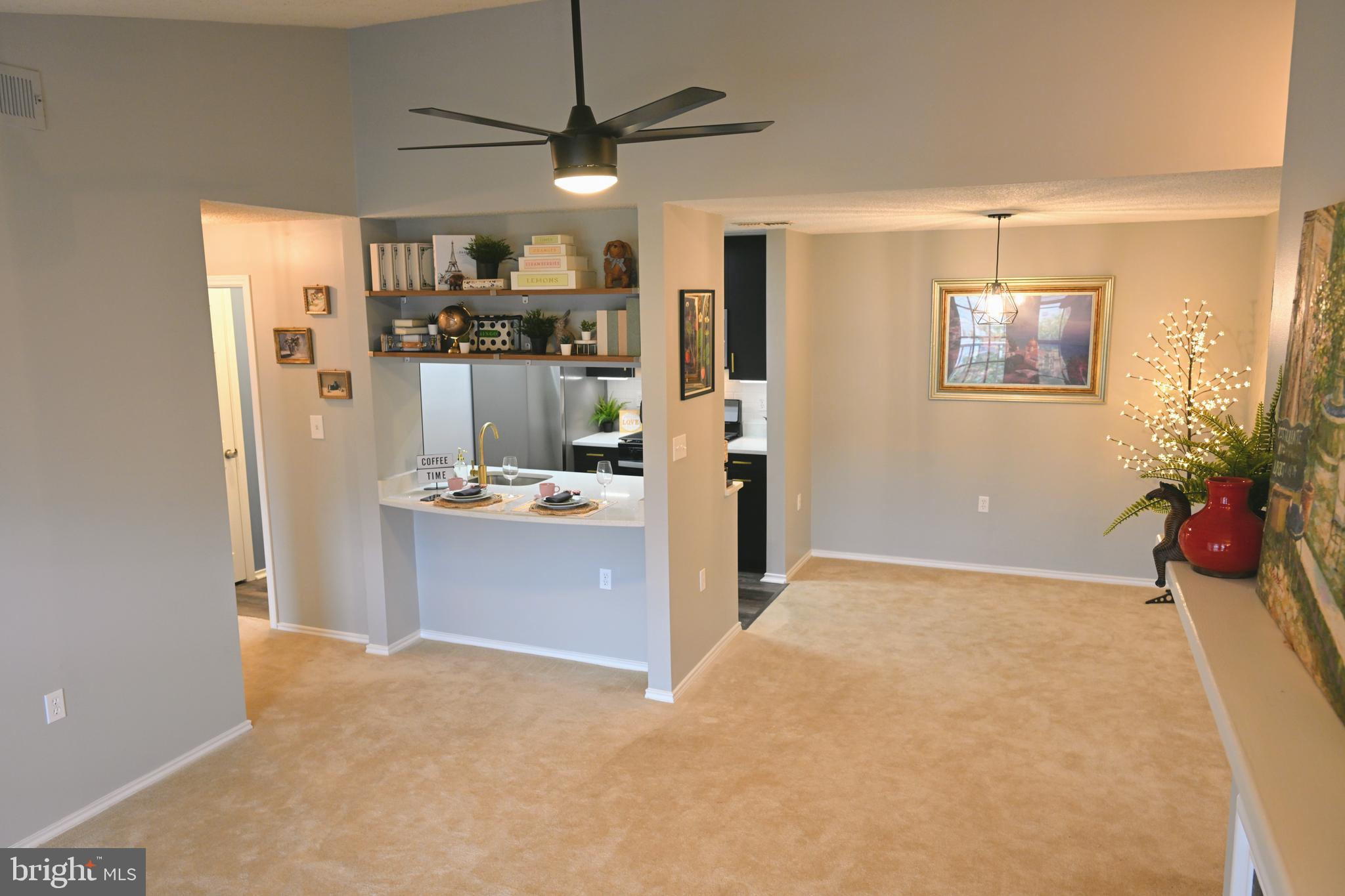 20965 Timber Ridge Terrace, Unit 304 Ashburn, VA 20147 - Photo 17 of 61 a view of kitchen and refrigerator