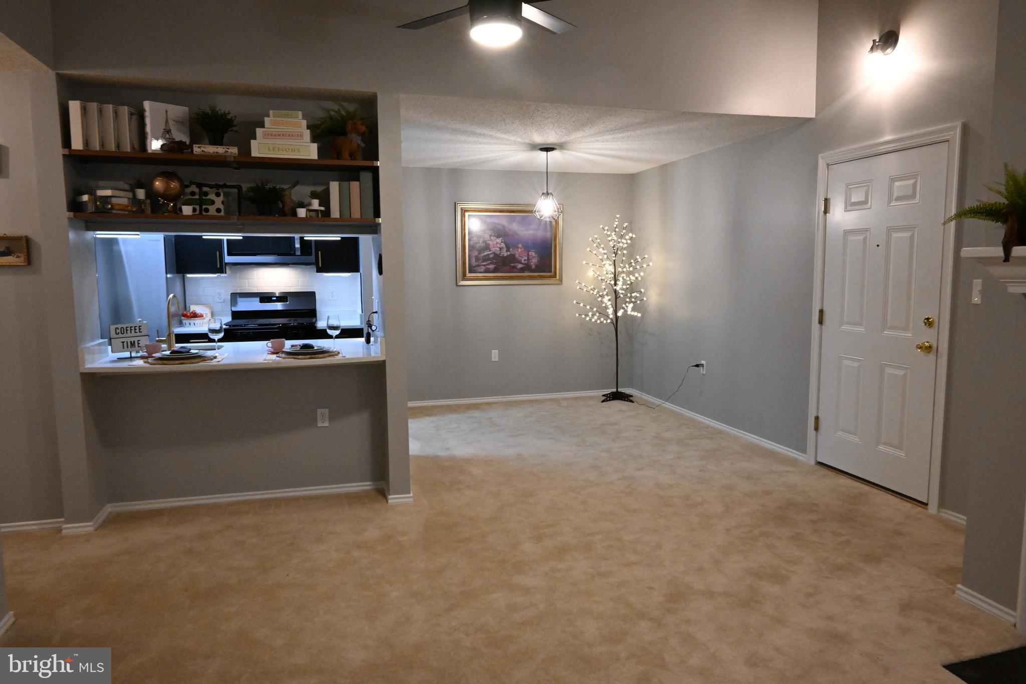 20965 Timber Ridge Terrace, Unit 304 Ashburn, VA 20147 - Photo 22 of 61 a view of kitchen with cabinets and wooden floor