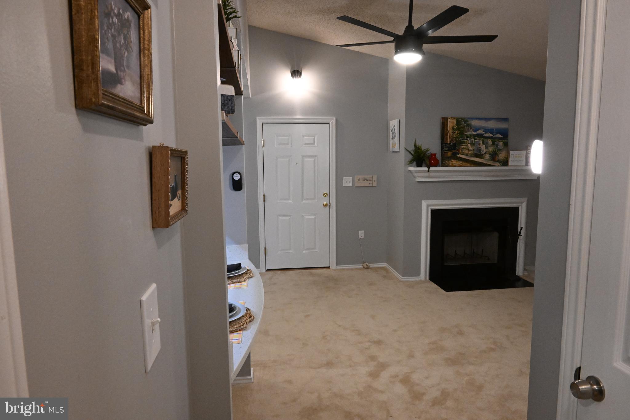 20965 Timber Ridge Terrace, Unit 304 Ashburn, VA 20147 - Photo 32 of 61 a view of an empty room with a fireplace