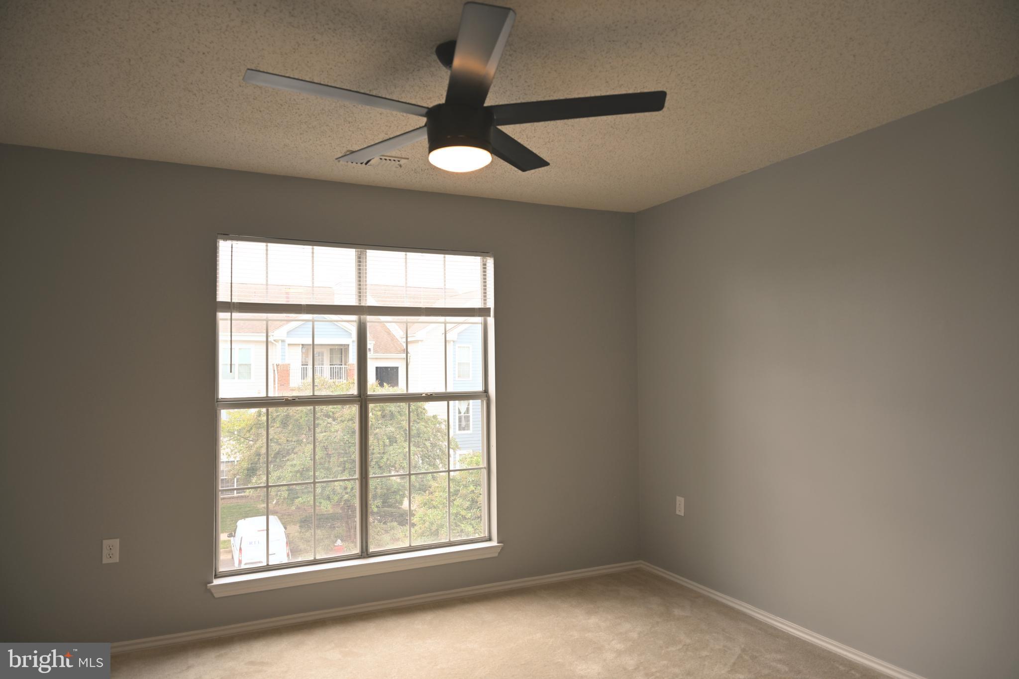 20965 Timber Ridge Terrace, Unit 304 Ashburn, VA 20147 - Photo 40 of 61 an empty room with a window