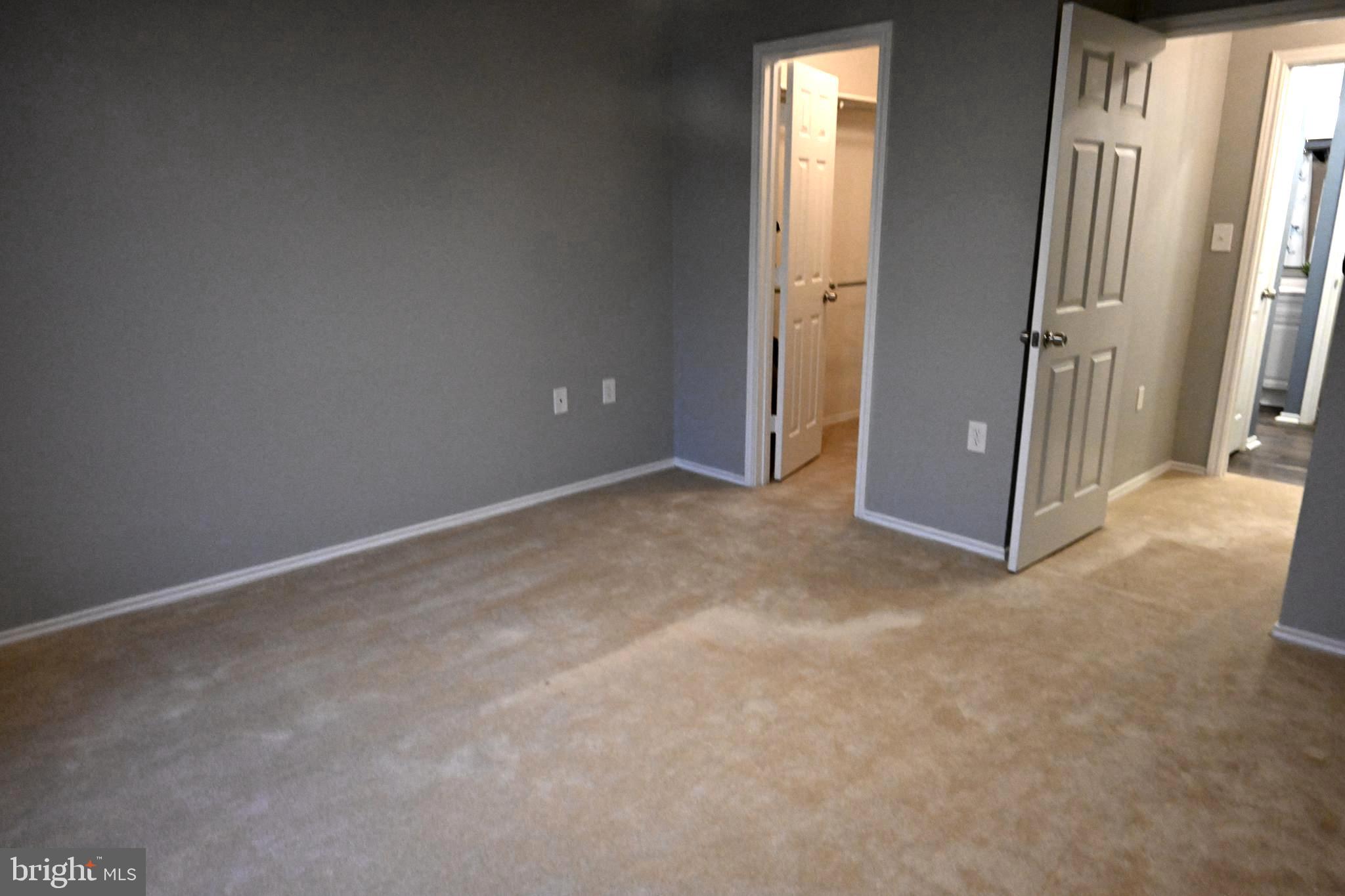 20965 Timber Ridge Terrace, Unit 304 Ashburn, VA 20147 - Photo 41 of 61 bedroom with walk-in closet