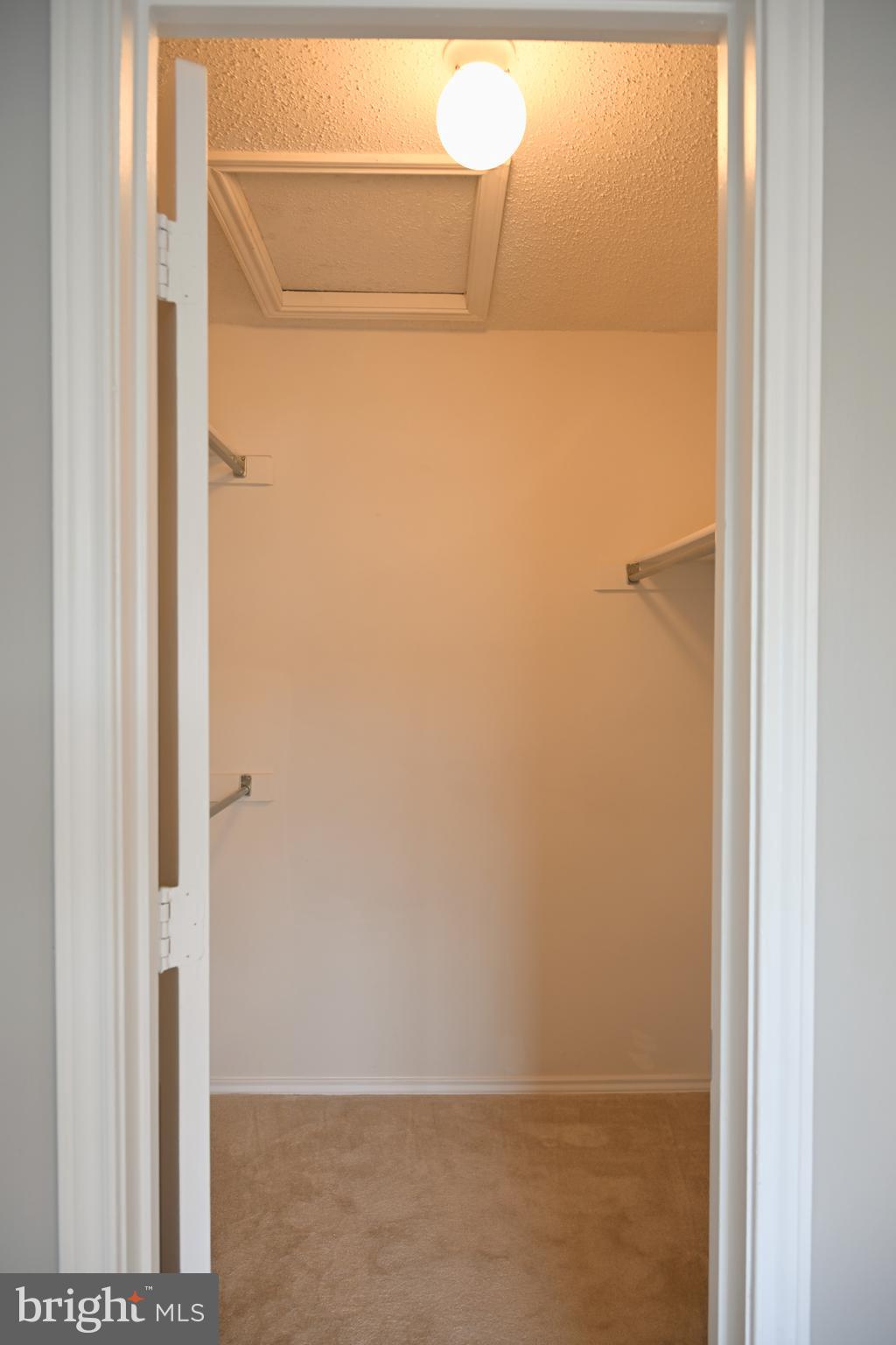 20965 Timber Ridge Terrace, Unit 304 Ashburn, VA 20147 - Photo 43 of 61 Walk-In closet with huge attic access