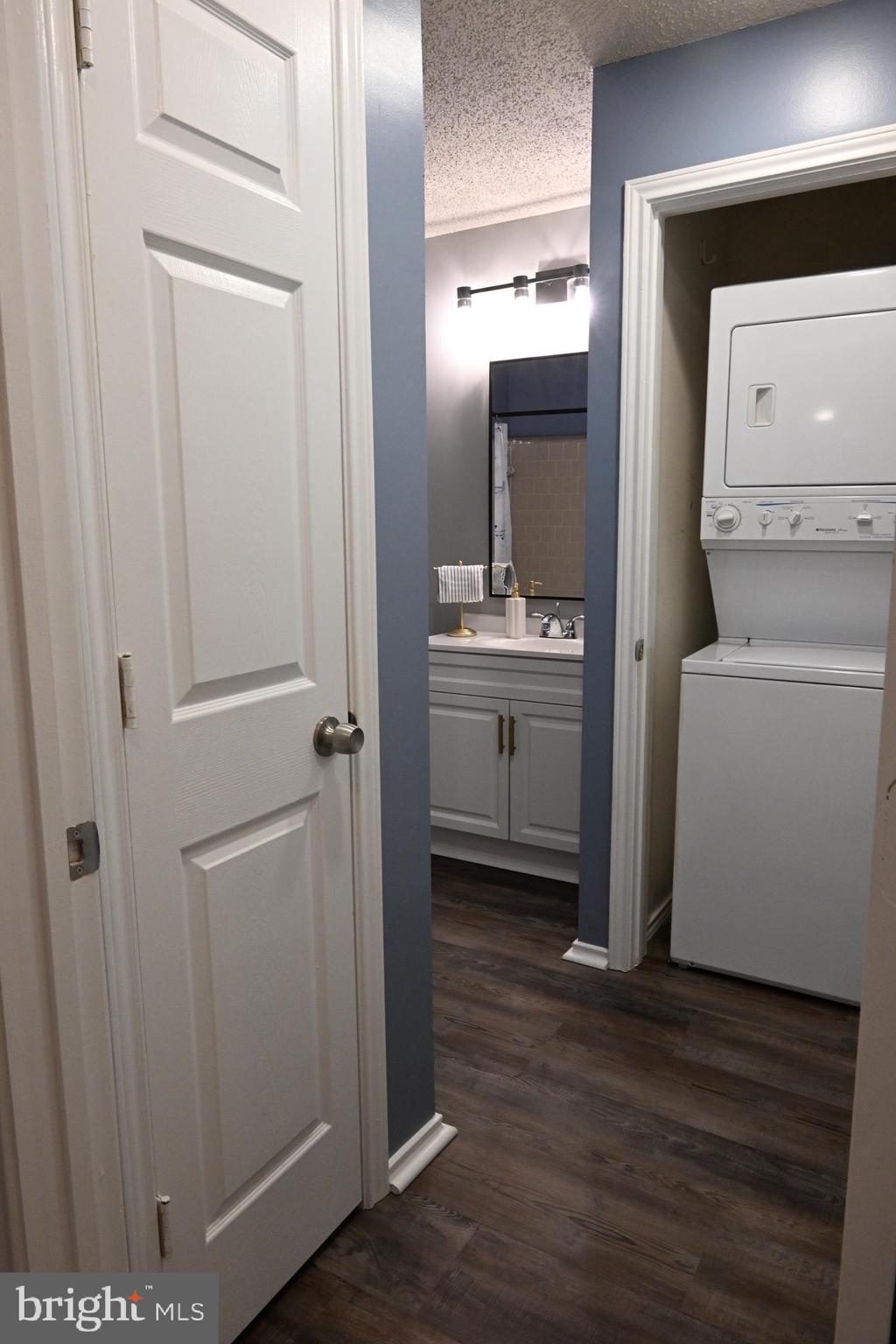 20965 Timber Ridge Terrace, Unit 304 Ashburn, VA 20147 - Photo 50 of 61 a view of hallway with washer and dryer