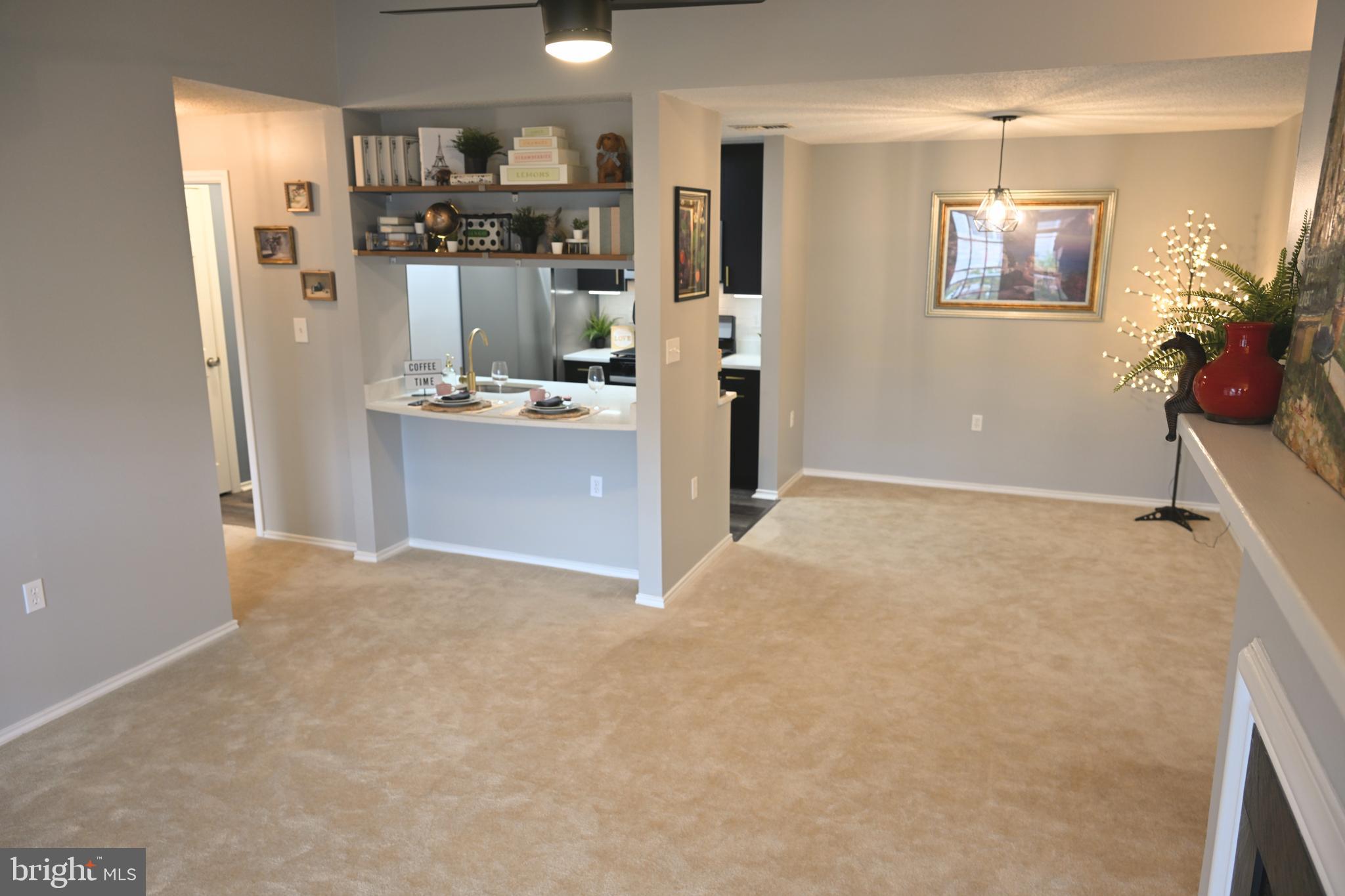 20965 Timber Ridge Terrace, Unit 304 Ashburn, VA 20147 - Photo 53 of 61 a view of kitchen and living room