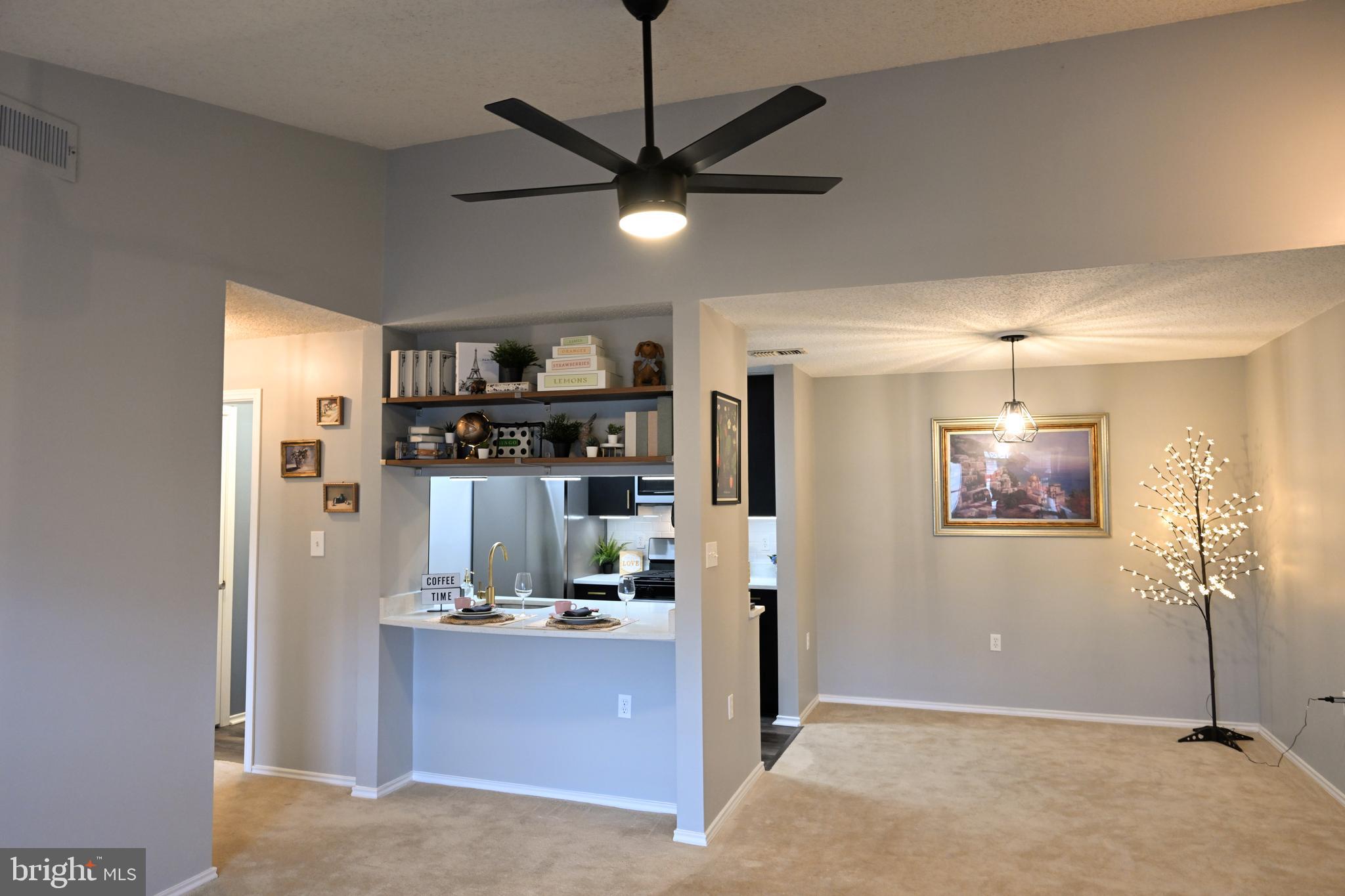 20965 Timber Ridge Terrace, Unit 304 Ashburn, VA 20147 - Photo 54 of 61 a view of kitchen with stainless steel appliances granite countertop cabinets and chandelier