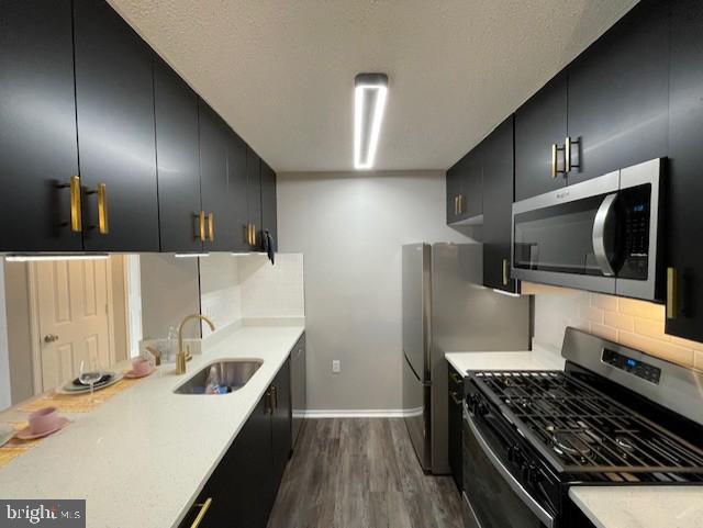 20965 Timber Ridge Terrace, Unit 304 Ashburn, VA 20147 - Photo 8 of 61 a kitchen with refrigerator and stove