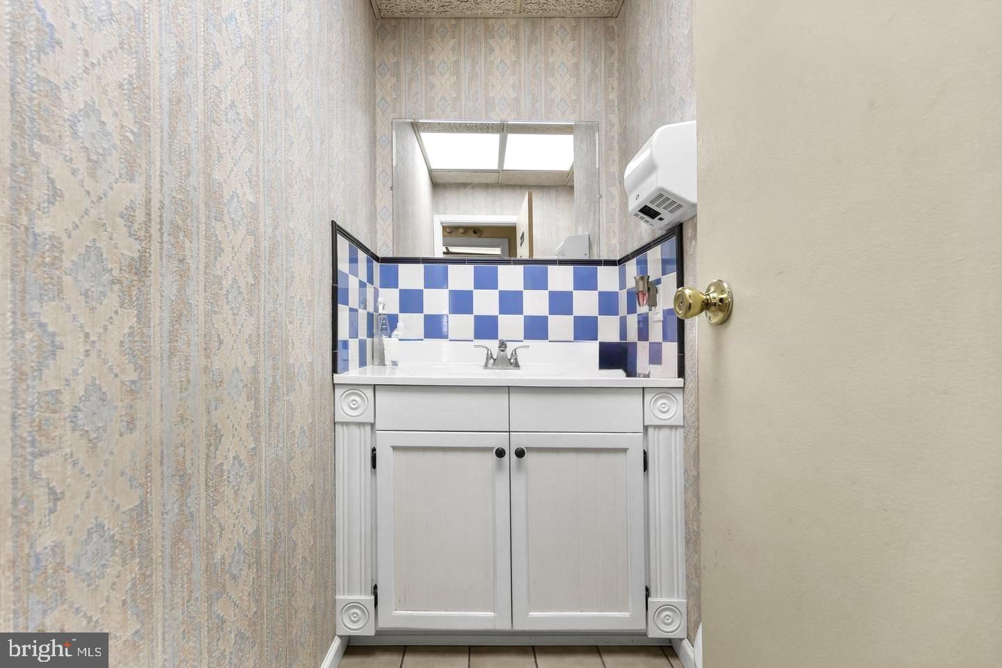 117 South Pavilion Avenue Riverside, NJ 08075 - Photo 33 of 38 a bathroom with a sink and a mirror