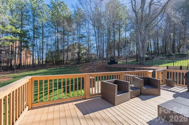a view of roof deck with two chairs and a table