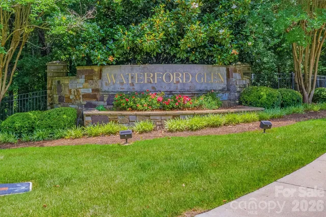 a view of yard with swimming pool and green space