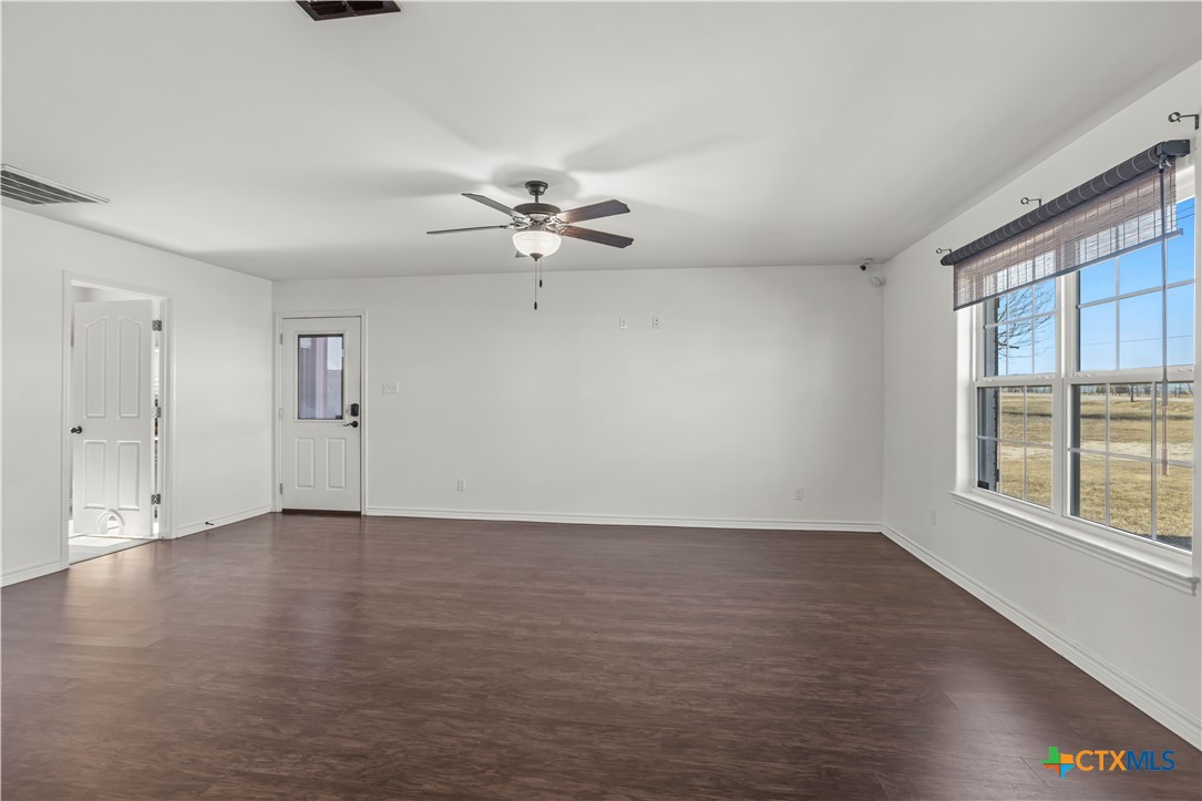 519 Pleasant View Road Troy, TX 76579 - Photo 11 of 33 wooden floor in an empty room with a window