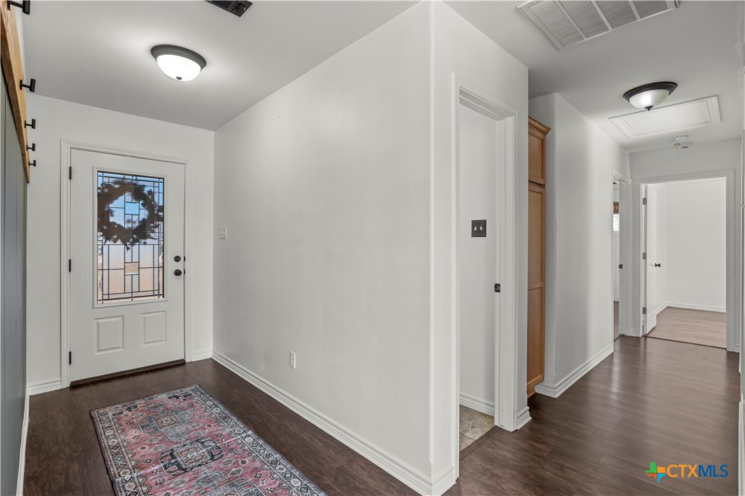519 Pleasant View Road Troy, TX 76579 - Photo 13 of 33 a view of an empty room and wooden floor