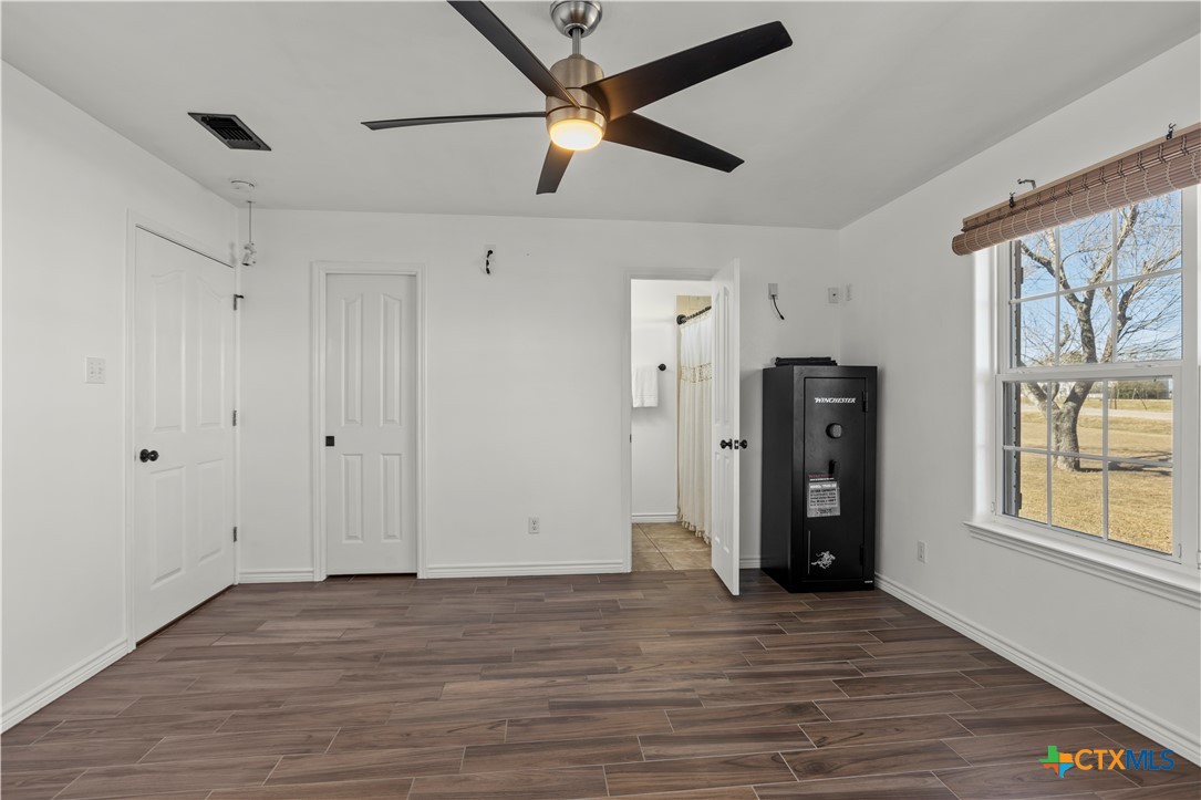 519 Pleasant View Road Troy, TX 76579 - Photo 15 of 33 a view of an empty room with window and wooden floor