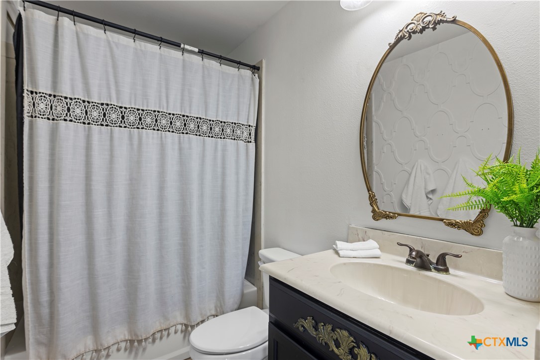 519 Pleasant View Road Troy, TX 76579 - Photo 20 of 33 a bathroom with a sink and a mirror