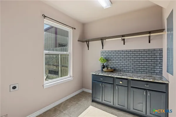 a bathroom with a sink and a shower