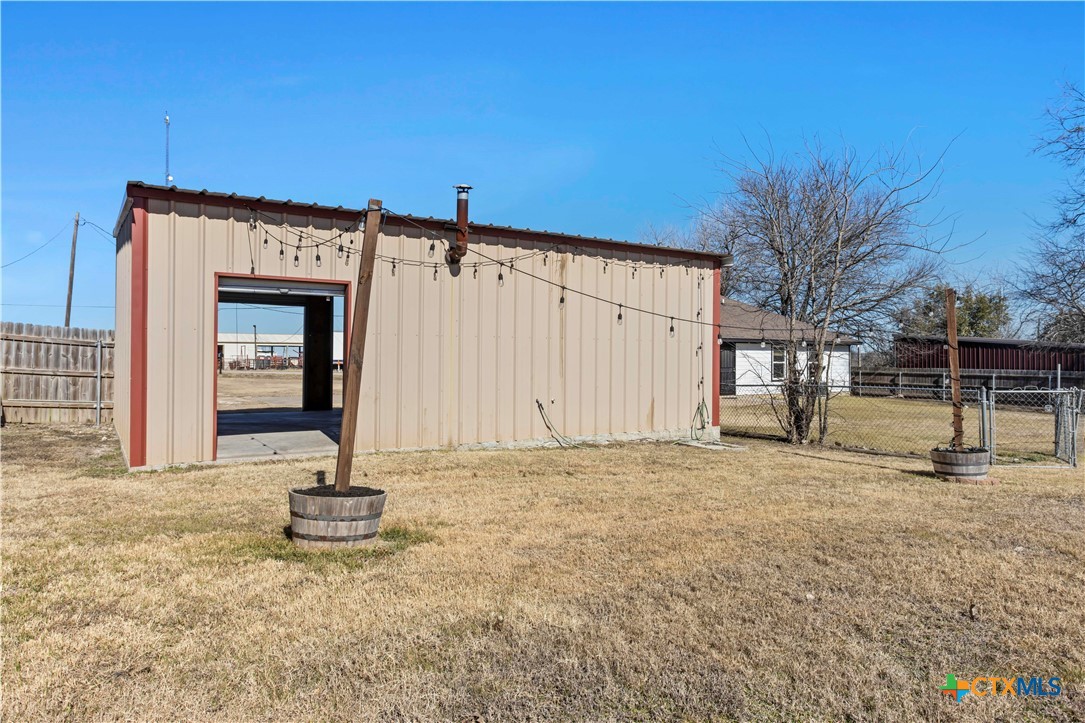 519 Pleasant View Road Troy, TX 76579 - Photo 32 of 33 a view of a backyard with a wooden fence