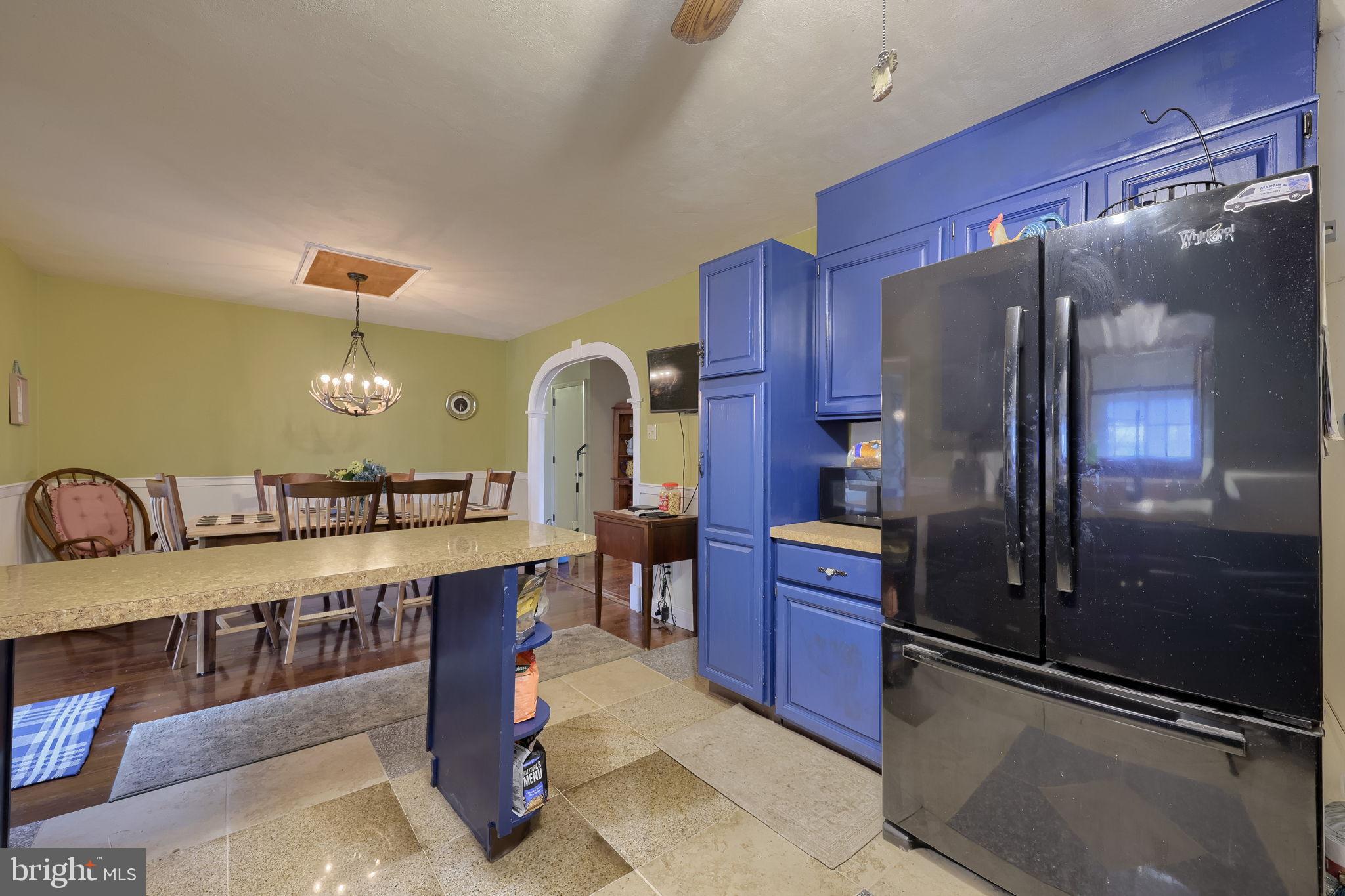 1019 Spring Valley Road Quarryville, PA 17566 - Photo 11 of 36 Charming kitchen with vibrant blue cabinetry.