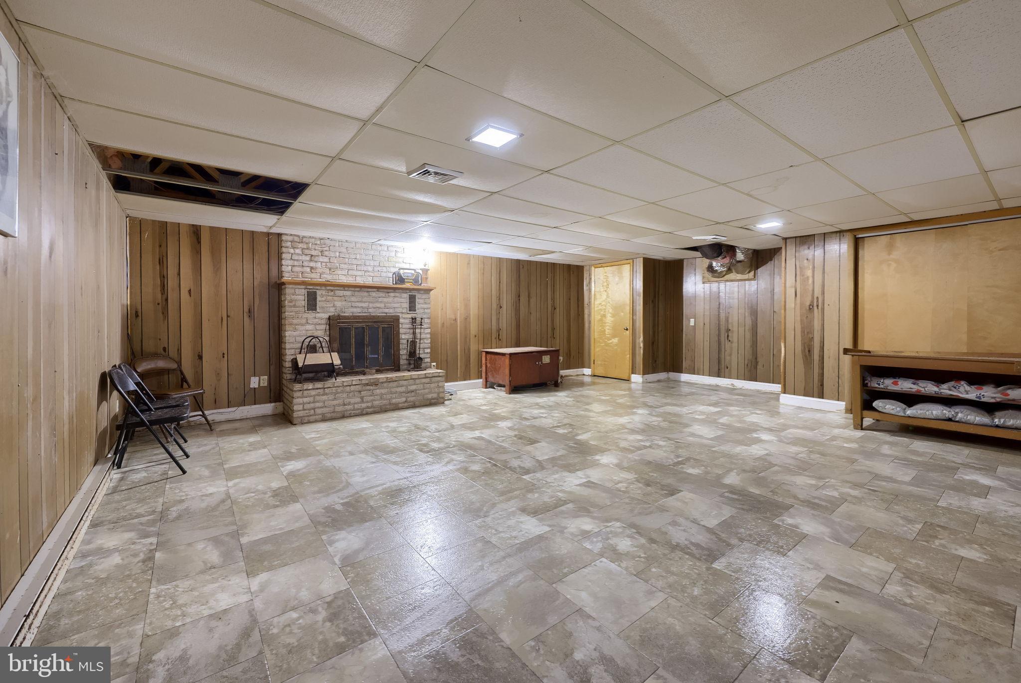 1019 Spring Valley Road Quarryville, PA 17566 - Photo 25 of 36 Spacious basement with cozy fireplace charm.