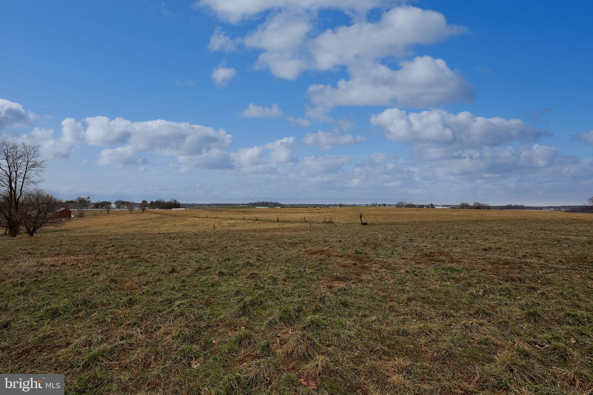 1019 Spring Valley Road Quarryville, PA 17566 - Photo 29 of 36 Expansive fields under a bright blue sky.