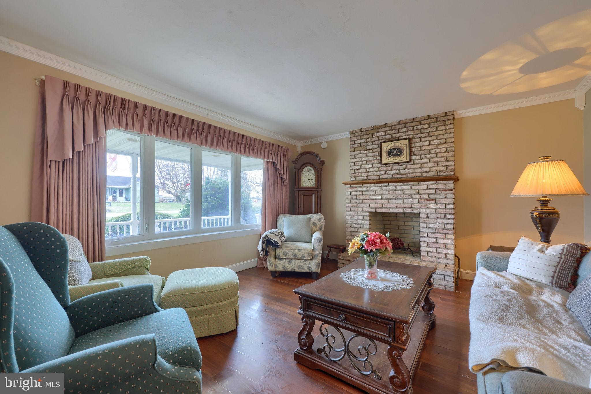 1019 Spring Valley Road Quarryville, PA 17566 - Photo 3 of 36 Cozy living room with charming brick fireplace.