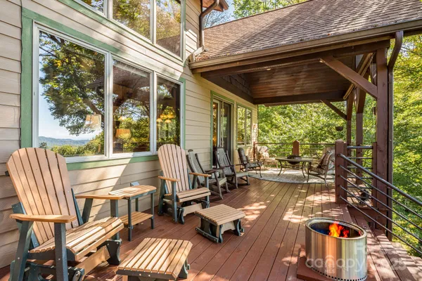 a view of balcony with chairs and wooden floor