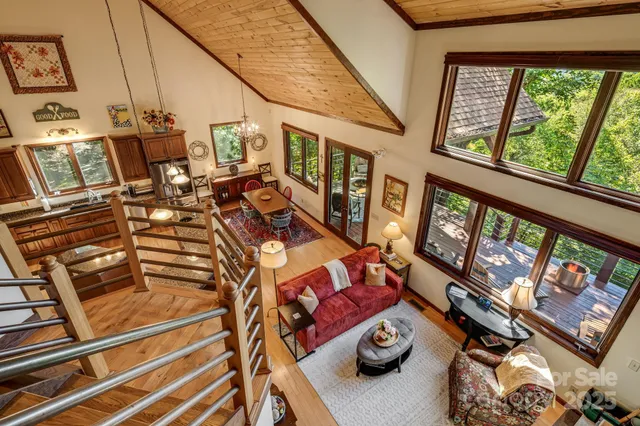 a view of living room with furniture and floor to ceiling window