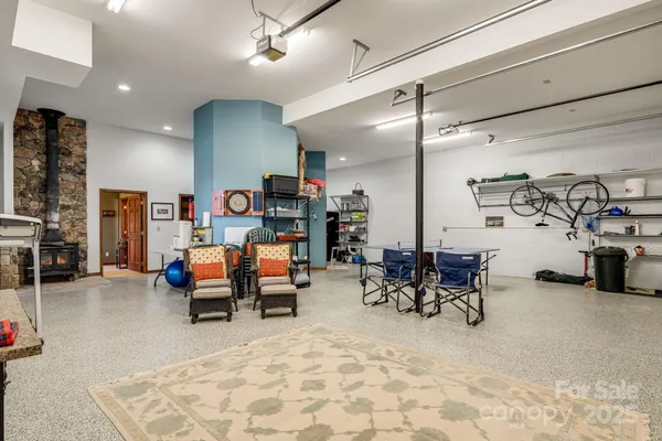 a living room with lots of furniture and gym equipment