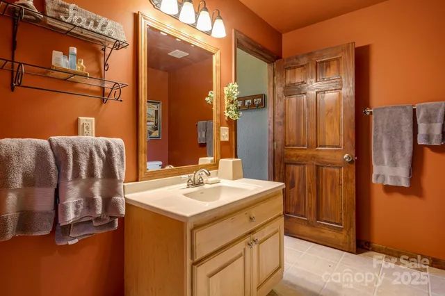a bathroom with a sink and mirror