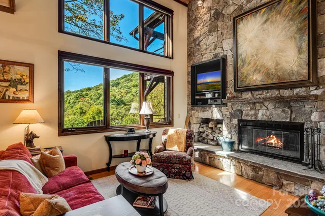 a living room with furniture fireplace and flat screen tv