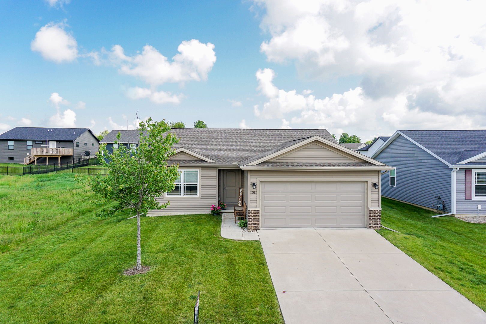 51 Winding Way Bloomington, IL 61705 - Photo 1 of 39 a front view of a house with garden