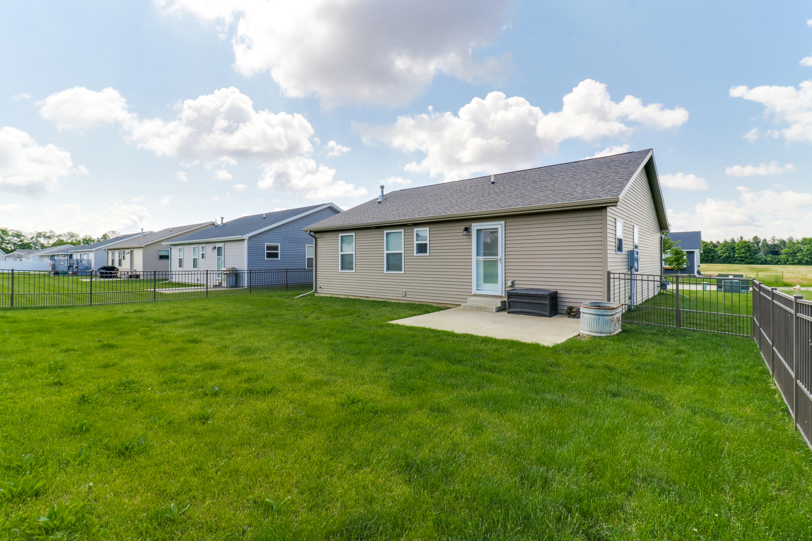 51 Winding Way Bloomington, IL 61705 - Photo 24 of 39 a view of a house with backyard sitting area and garden