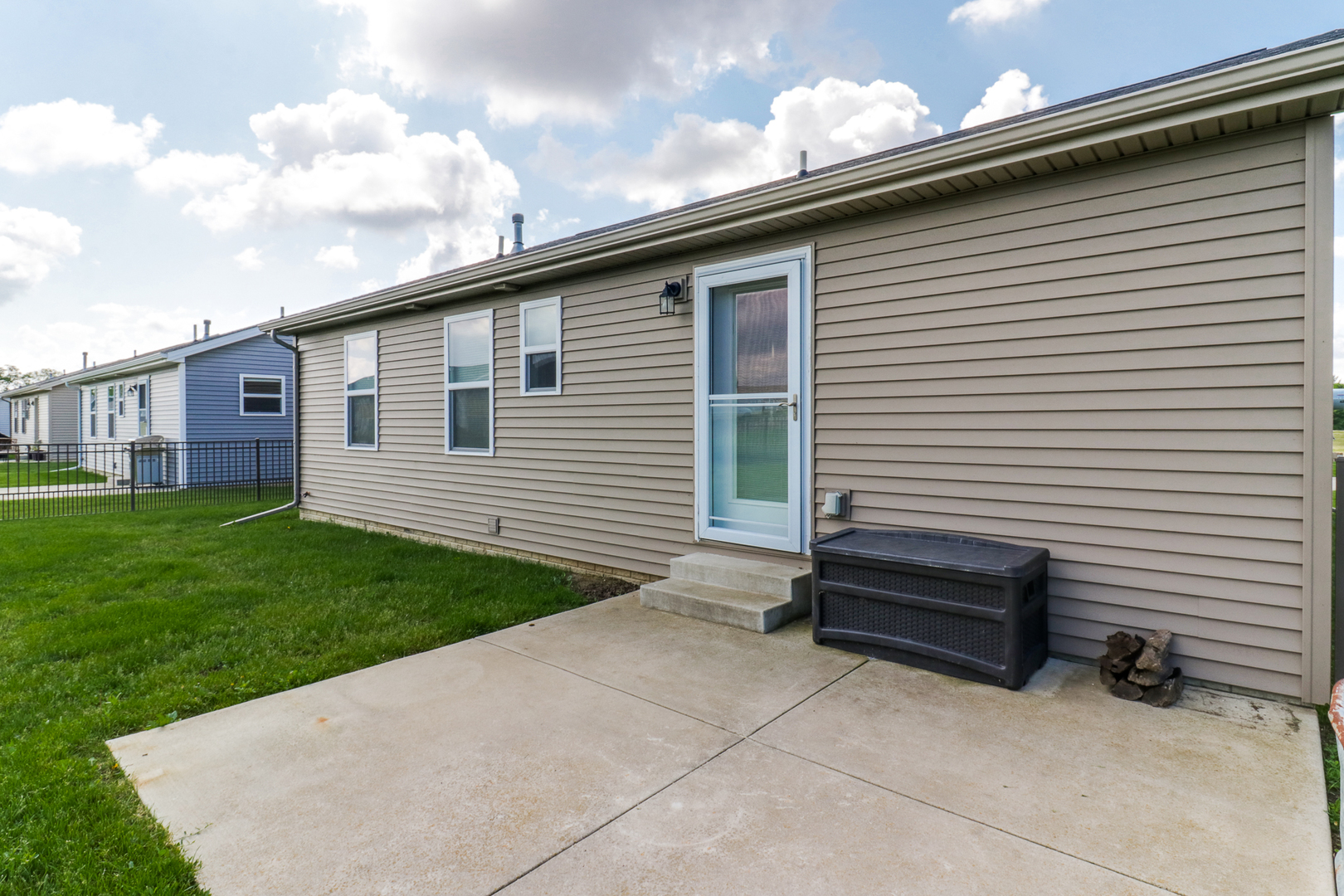51 Winding Way Bloomington, IL 61705 - Photo 28 of 39 a backyard of a house with barbeque oven table and chairs