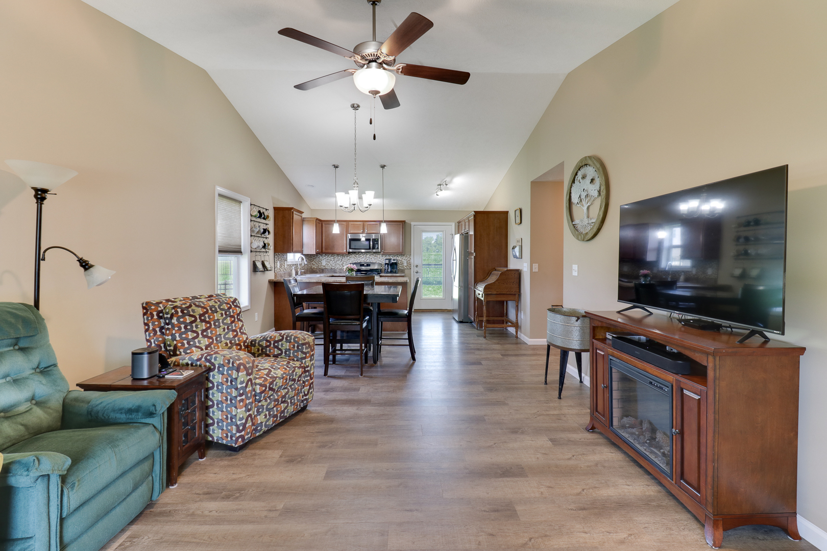51 Winding Way Bloomington, IL 61705 - Photo 3 of 39 a living room with furniture and a flat screen tv