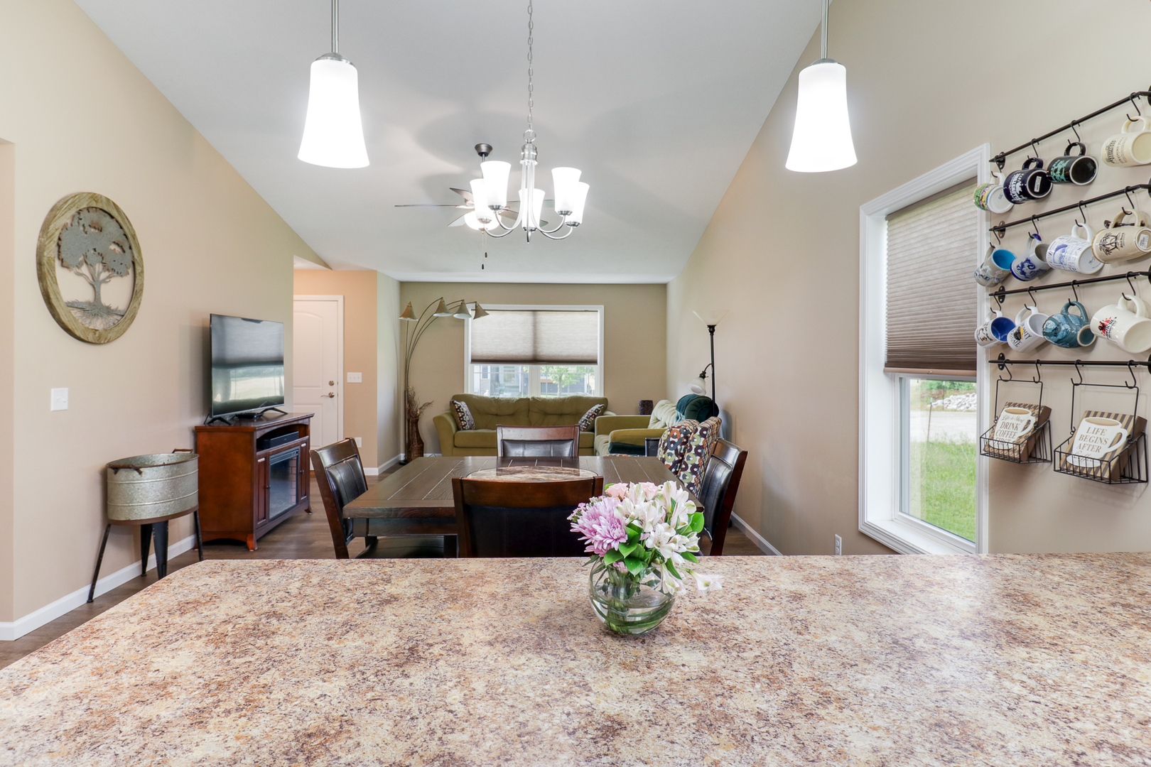 51 Winding Way Bloomington, IL 61705 - Photo 10 of 39 a living room with furniture a chandelier and a dining table