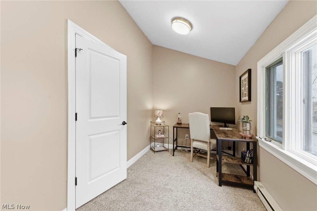3525 Silsby Road Cleveland, OH 44118 - Photo 29 of 44 Office space with light colored carpet, a baseboard radiator, and vaulted ceiling