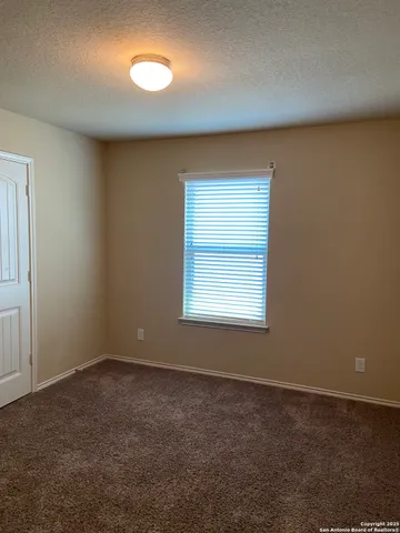 an empty room with a empty space and a window