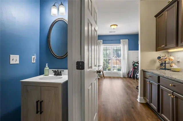 a en suite bathroom with a sink and a mirror