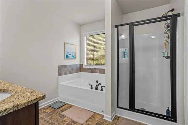 a bathroom with a tub and a sink