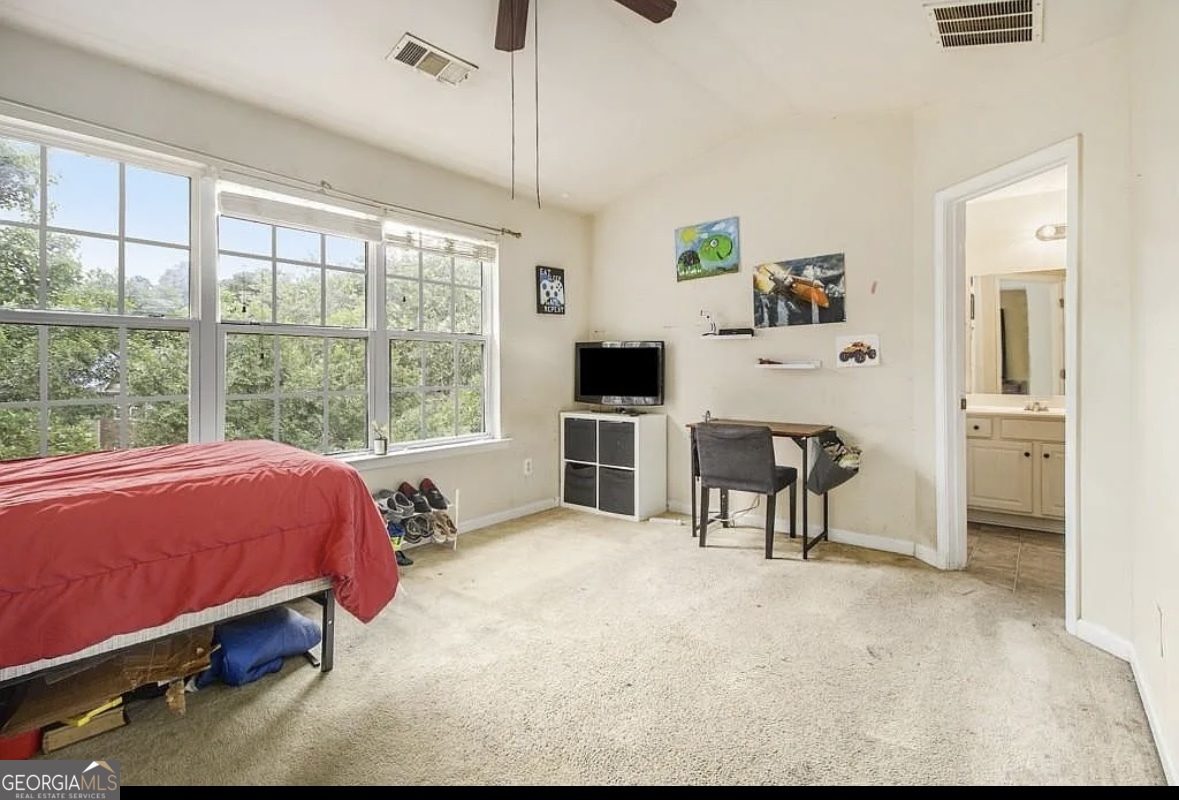 3669 Utoy Drive Southwest Atlanta, GA 30331 - Photo 16 of 22 a bed room with a bed and a chair