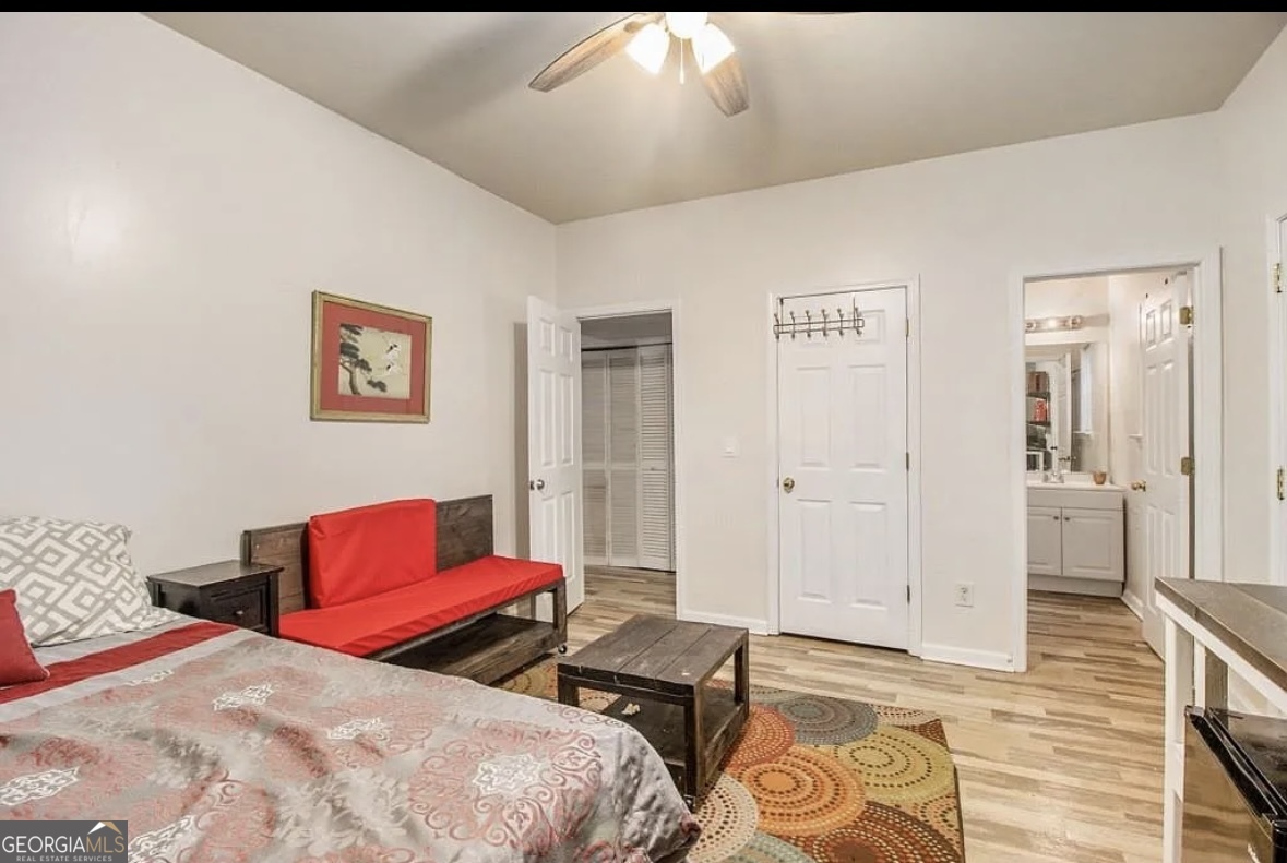 3669 Utoy Drive Southwest Atlanta, GA 30331 - Photo 20 of 22 a bedroom with bed and a couch