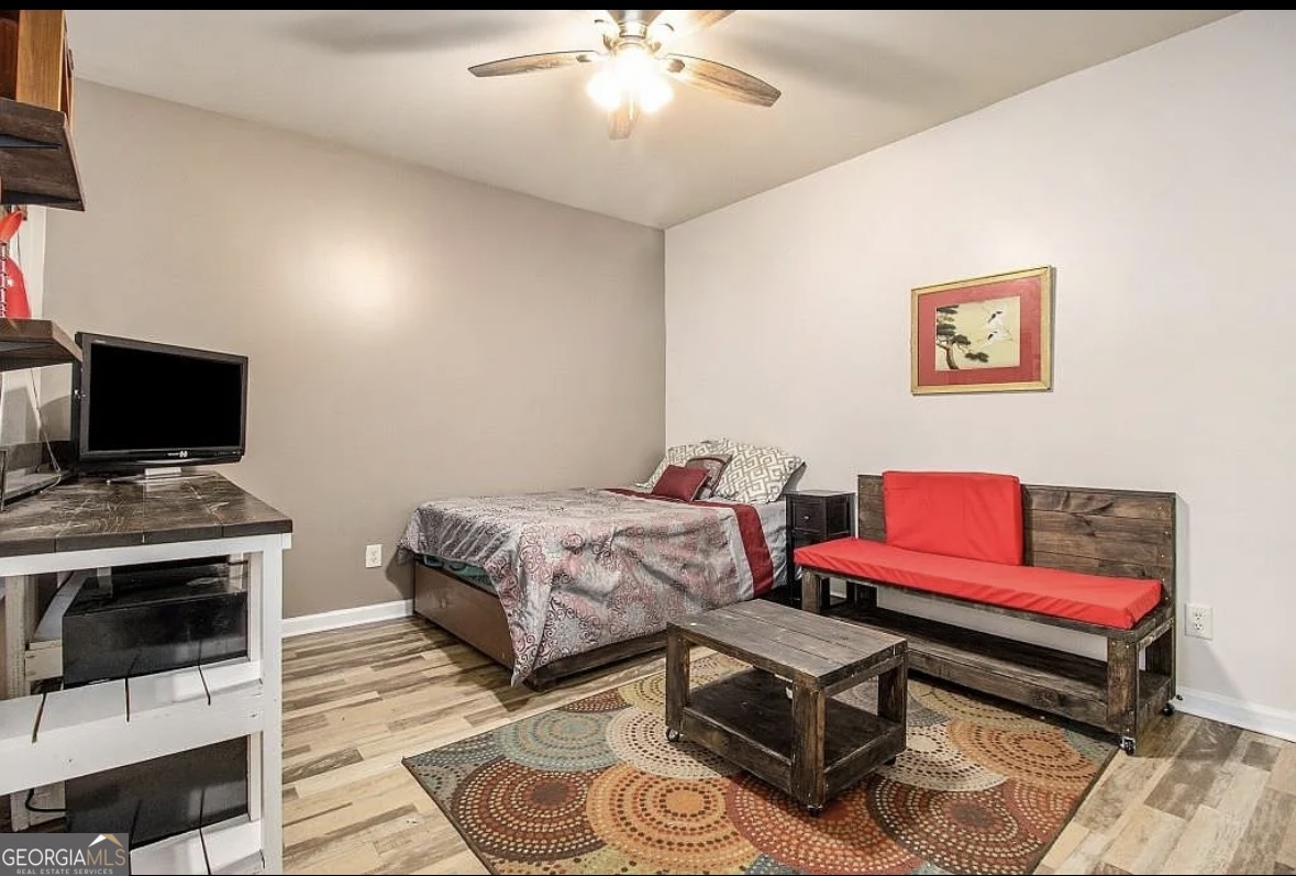 3669 Utoy Drive Southwest Atlanta, GA 30331 - Photo 21 of 22 a living room with furniture and a flat screen tv
